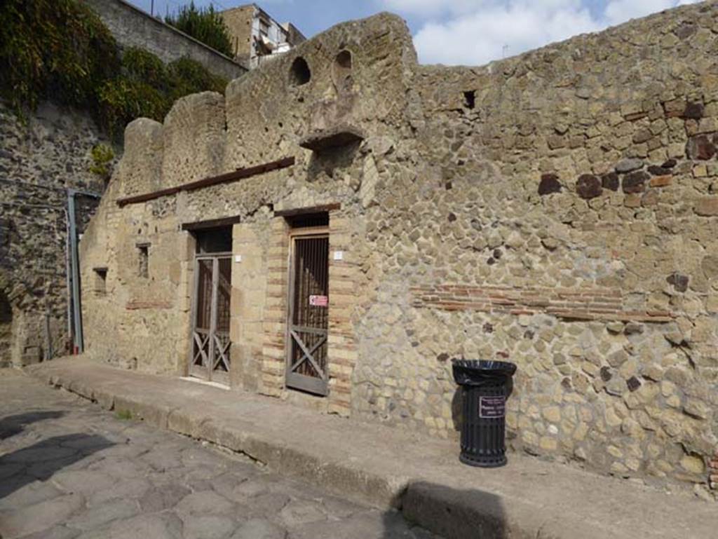 VII,18 and 17, Herculaneum, October 2014. Looking towards entrance doorways. An upper floor latrine would have been accessible from the balcony. Photo courtesy of Michael Binns.
